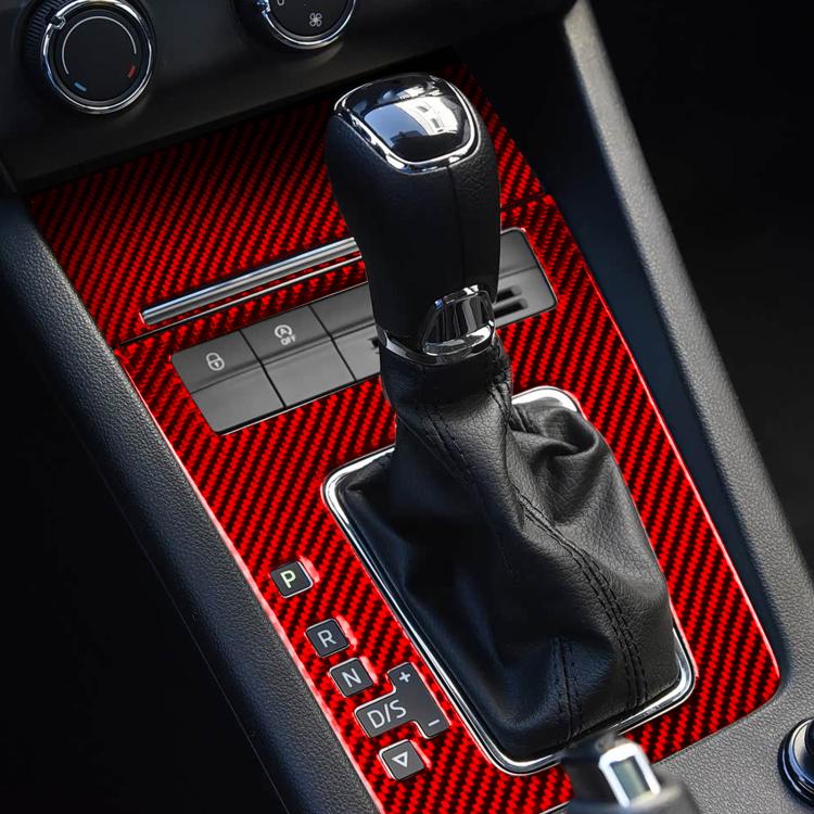 Red carbon-fiber gear shift panel trim sticker surrounding a leather shift knob and boot.