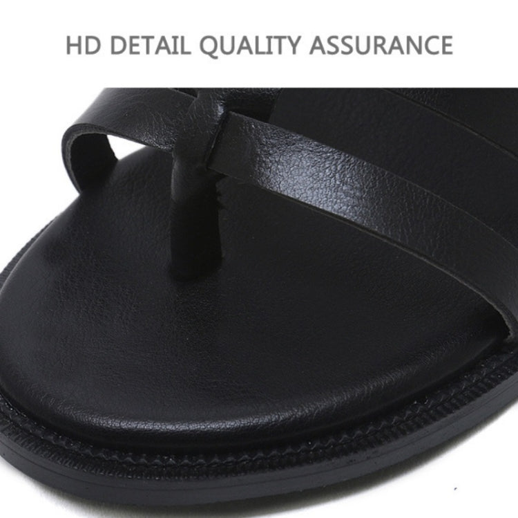 Black flat sandal outsole with textured edge stitching and smooth upper panel