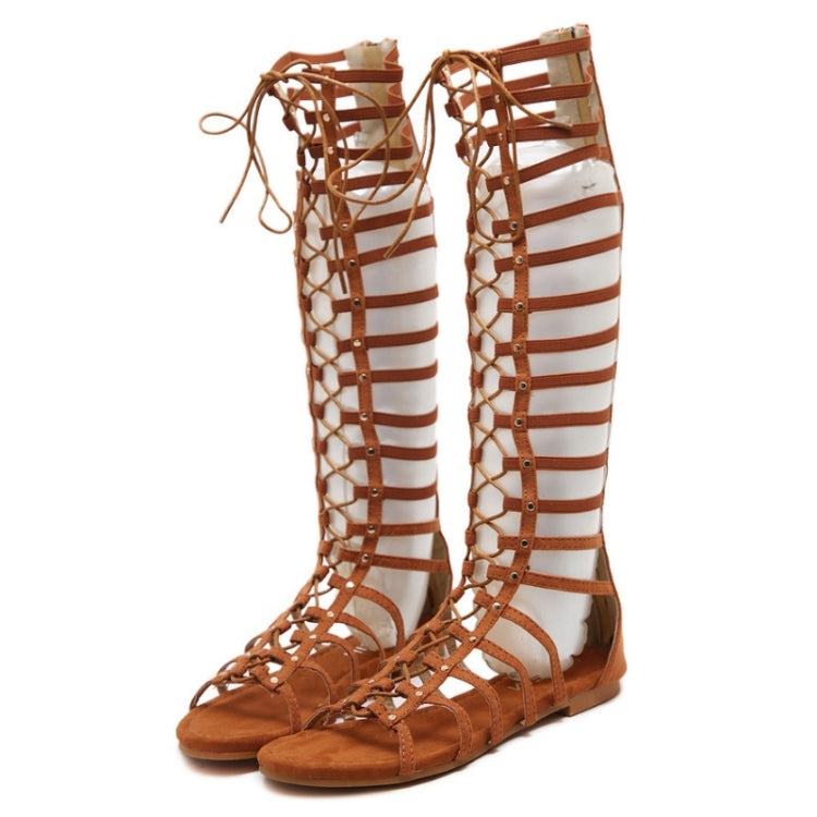 Brown high-top sandals with striped cutout bands and front lace-up closure