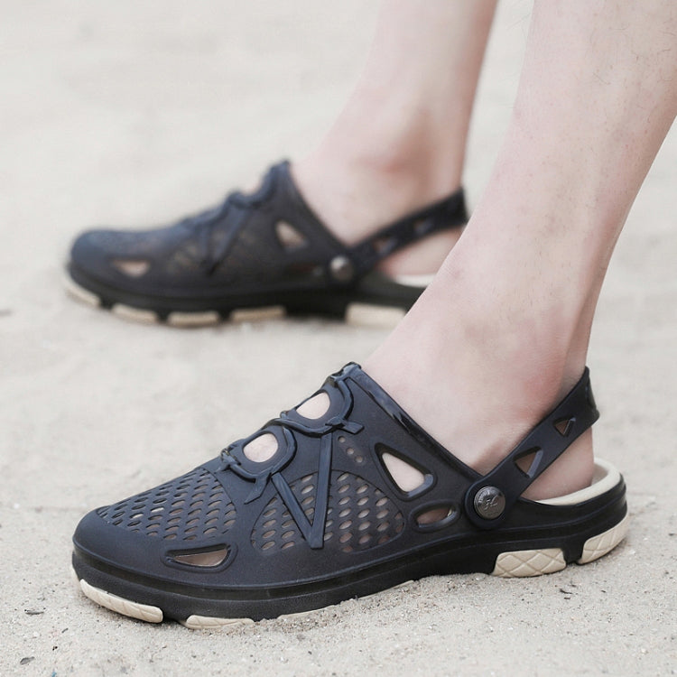 Navy slip-on clogs on feet with perforated upper and adjustable side strap