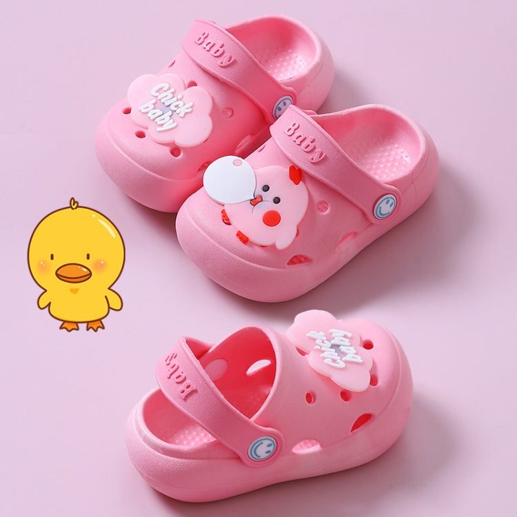 Children's pink clogs with cartoon face details and perforated interior