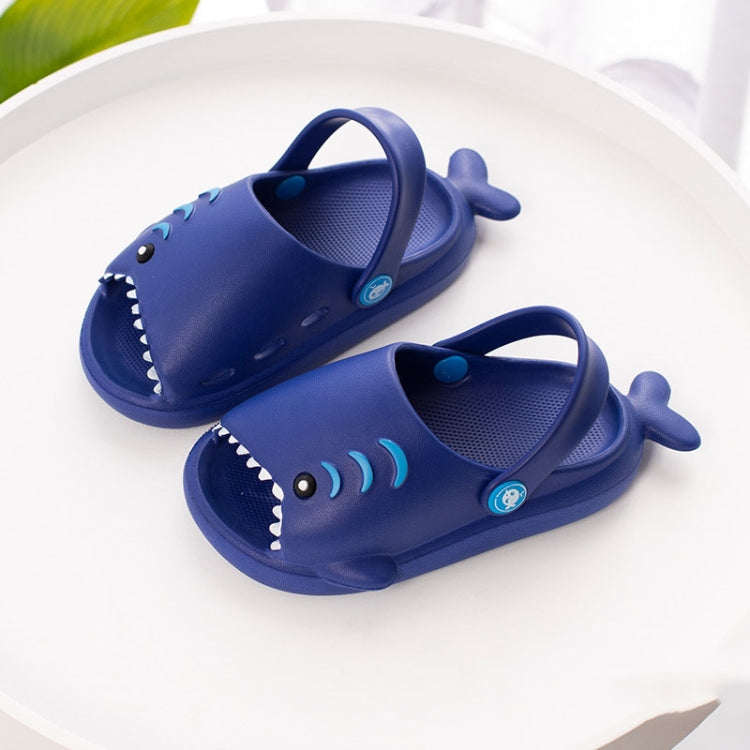 Navy EVA shark slippers for kids, front-facing view with eye and wave stripe details