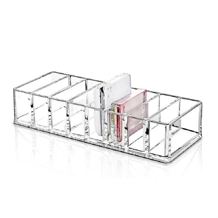 Transparent acrylic makeup organizer with cubby rows for lipsticks and eyeshadow