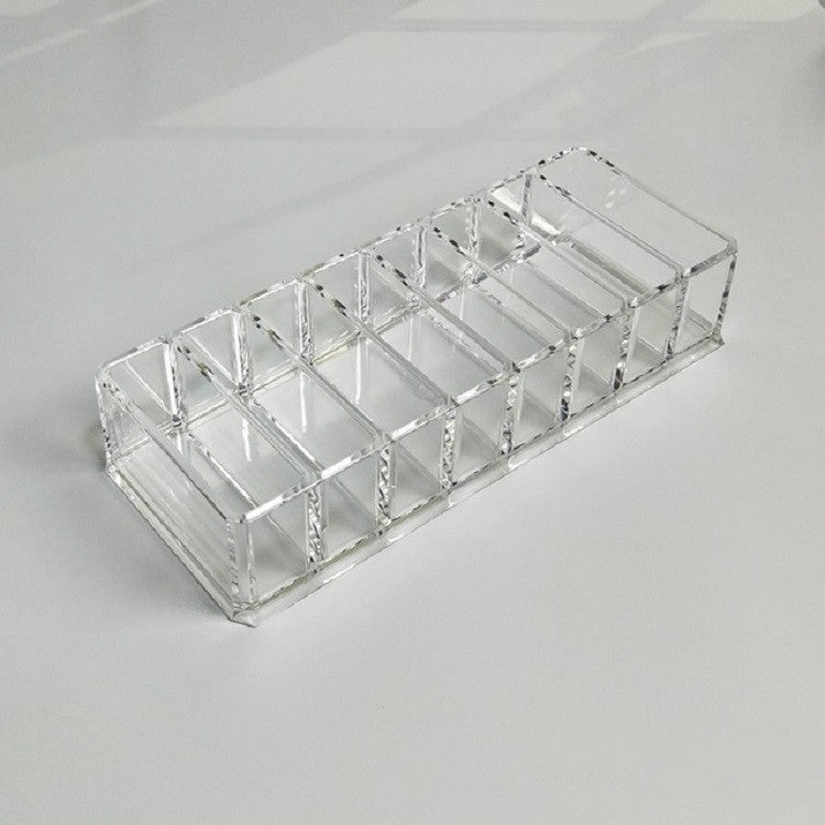 Clear acrylic makeup organizer tray with long row of separate compartments
