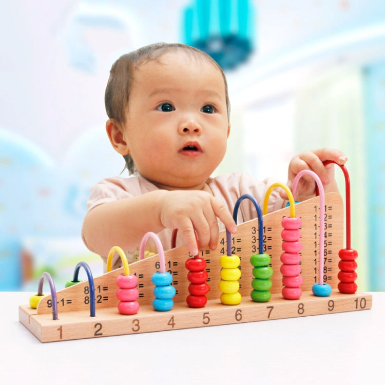 Baby holding a wooden bead calculation frame with colorful rods and number base 1–10