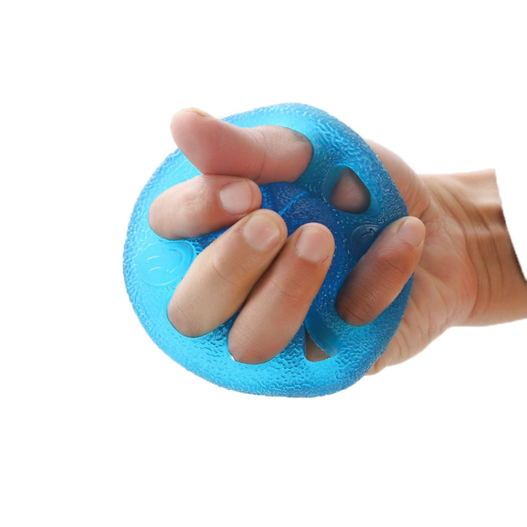 Blue eight-hole finger gripper squeezed by hand, showing textured edges