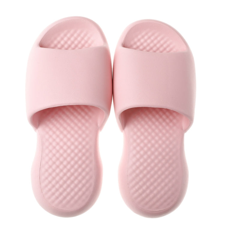 Pink plastic bathroom slippers, open-toe slides with grippy textured footbed