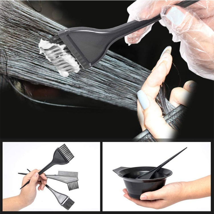 Hair dye brush applying product to hair with mixing bowl and gloved hands