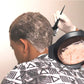 Salon hair dye application using mixing bowl and brush near the scalp
