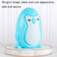 Blue penguin-shaped toy with standing penguin and circular rotating platform base