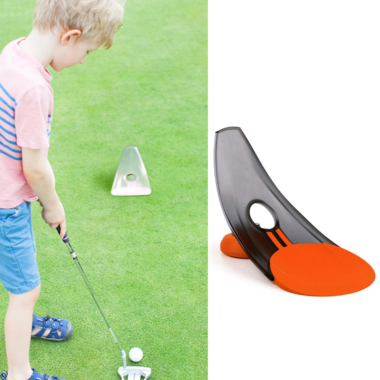 Orange and black golf putting trainer with sloped track and round target opening