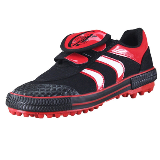 Kids black and red soccer shoes with hook-and-loop straps and molded cleats