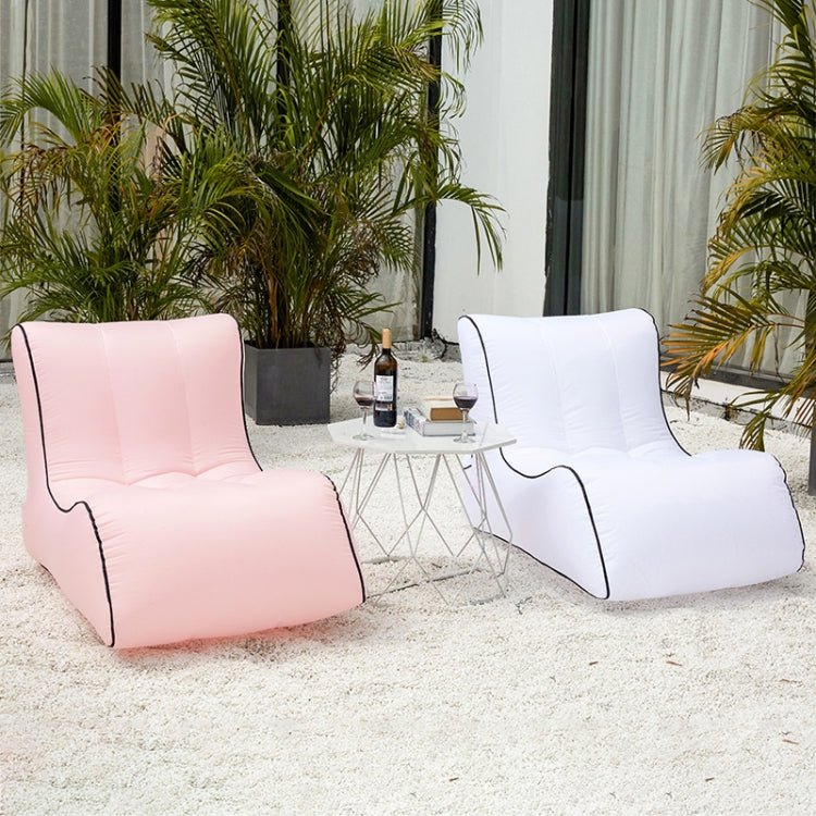 Pair of inflatable lounge seats in pink and white with black trim and backrests.