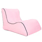 Pink inflatable single lounge seat with black trim and curved backrest.
