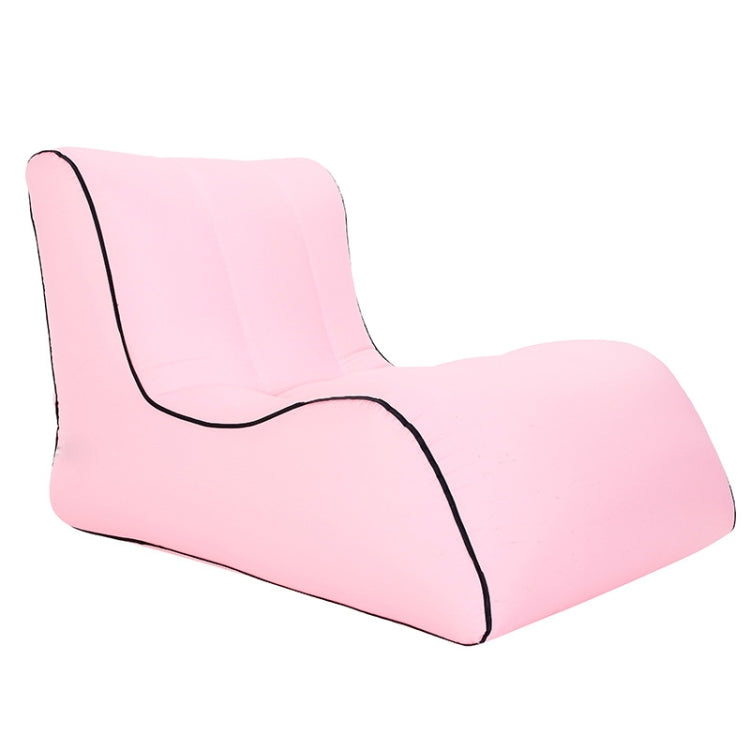 Pink inflatable single lounge seat with black trim and curved backrest.