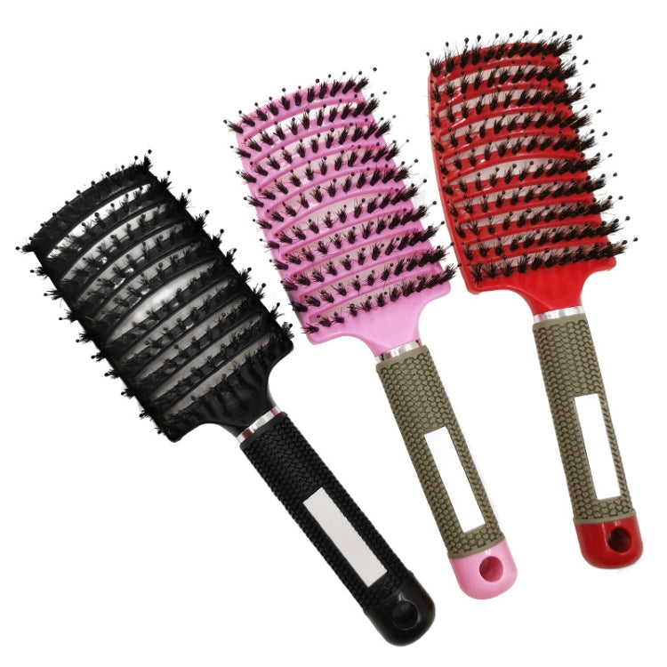 Set of three curved hair brush combs with black, pink, and red bristles and textured handles