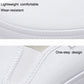 White canvas low-top sneaker with stitched collar and textured side fabric