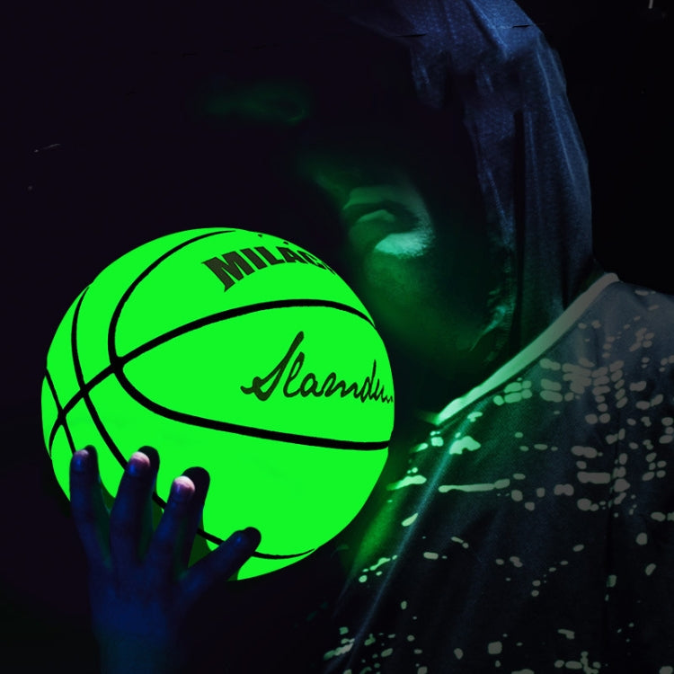 Fluorescent green reflective basketball glowing in a hand, near a seated person
