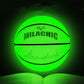 Fluorescent green reflective basketball above an open book, holographic glow