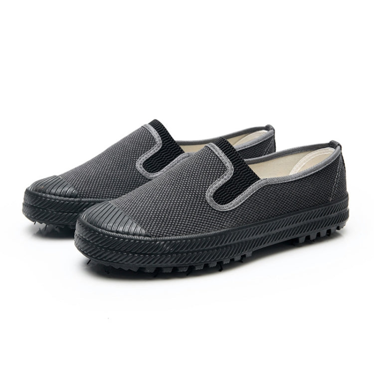 Men's slip-on work shoes in dark gray textured fabric, elastic side gore, treaded rubber sole