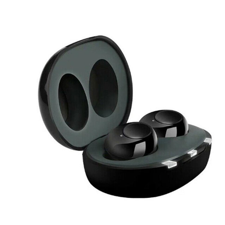 Wireless hearing aid earbuds with open charging case, dark/black ear tips and slots