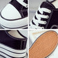 Thick-soled canvas platform slip-on close-up: laces, stitching, and textured rubber outsole