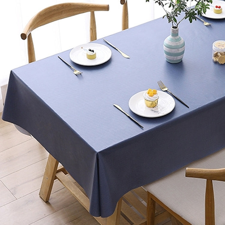 Navy blue waterproof disposable tablecloth draped over a dining table