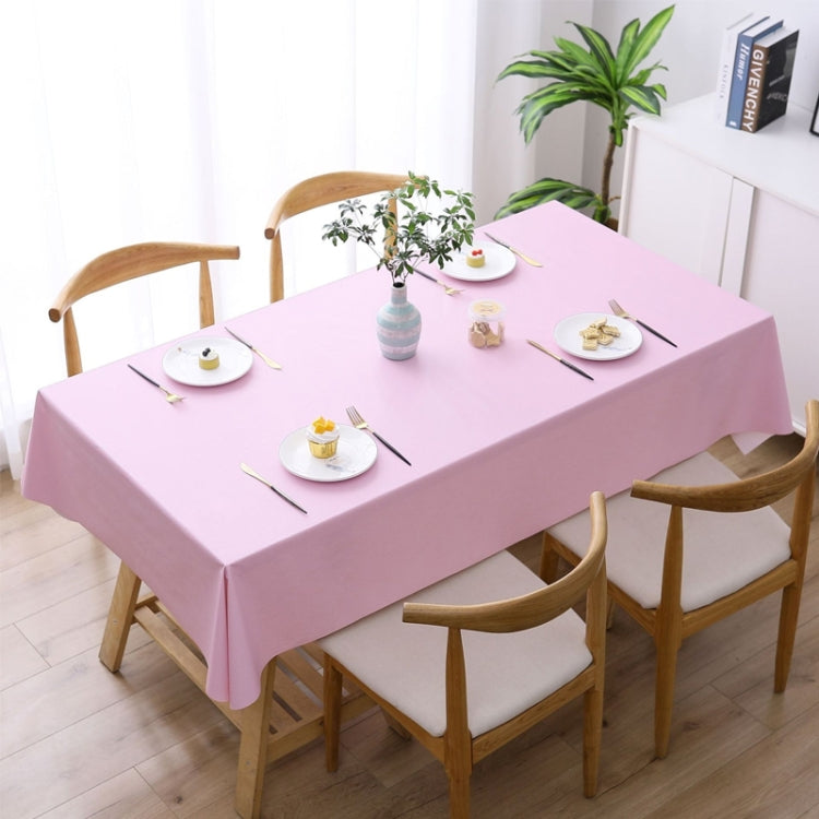 Pink waterproof disposable tablecloth covering a dining table