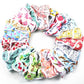 Assorted cartoon-print dog diaper pants in mixed colorful designs