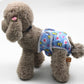 Dog anti-estrus belly wrap pants in blue cartoon print with elastic leg openings
