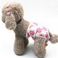 Dog estrus wrap pants with white and pink animal print, adjustable side openings