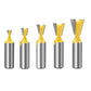 Set of dovetail wood milling cutters, five yellow bits with silver shanks