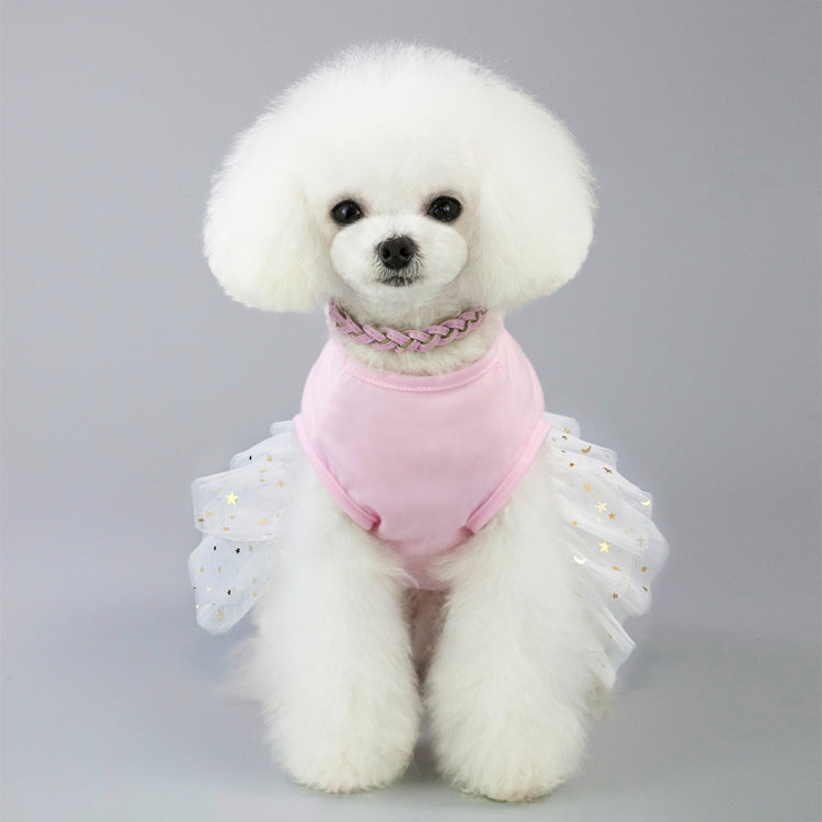 Small dog wearing pink bunny-themed dress with braided scarf collar and star tulle sleeves
