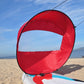 Downwind kayak sail, red inflatable sail with black rim and clear window panel