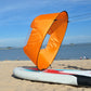 Downwind kayak sail, orange inflatable sail with black rim and clear window panel on board