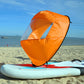 Downwind kayak sail, orange inflatable sail with black rim and clear window panel on board