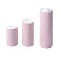 Pink-and-white elastic compression bandage rolls, textured knit fabric for self-adhesion