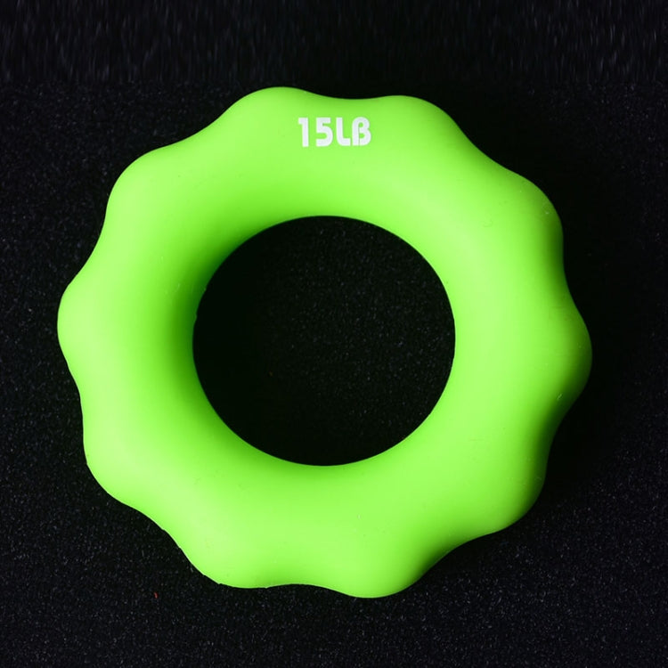 Green 15LB silicone finger exercise grip ring with round center opening.