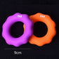 Purple 75LB and orange 55LB silicone finger grip rings with round openings.