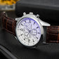 Close-up of three-eye six-hand quartz watch with silver case and brown leather strap