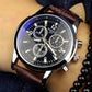 Men’s quartz wristwatch close-up with white dial and three subdials, brown leather strap