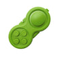 Green handle decompression toy with five raised buttons and round central disc