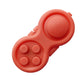 Red handle decompression toy with five raised buttons and round central disc