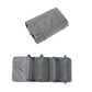 Gray cosmetics storage bag with multiple zip compartments and a rolled top cover
