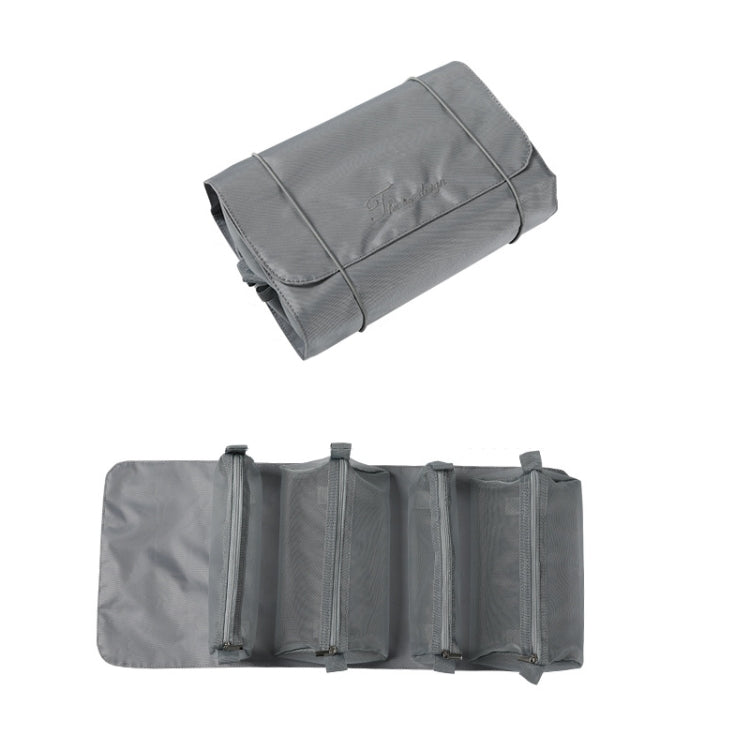 Gray cosmetics storage bag with multiple zip compartments and a rolled top cover