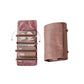 Pink cosmetics storage bag with removable clear pouches and wraparound drawstring strap