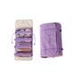 Purple cosmetics storage bag with removable clear pouches and stitched label detail