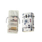 White cosmetics storage bag with removable clear pouches and playful print