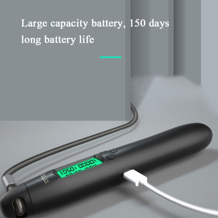 Charging cable connected to black skipping rope handle with green digital screen
