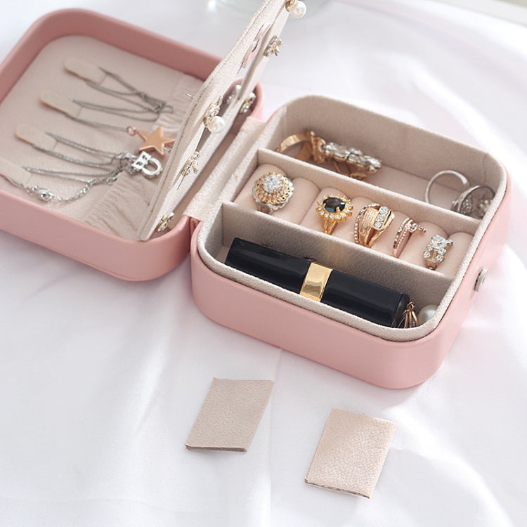 Pink portable jewelry box open with ring and earring organizer compartments